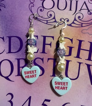 Image of Candy Heart Snake Vertebrae Earrings