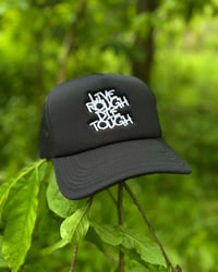 Black “Tag” Trucker Hat
