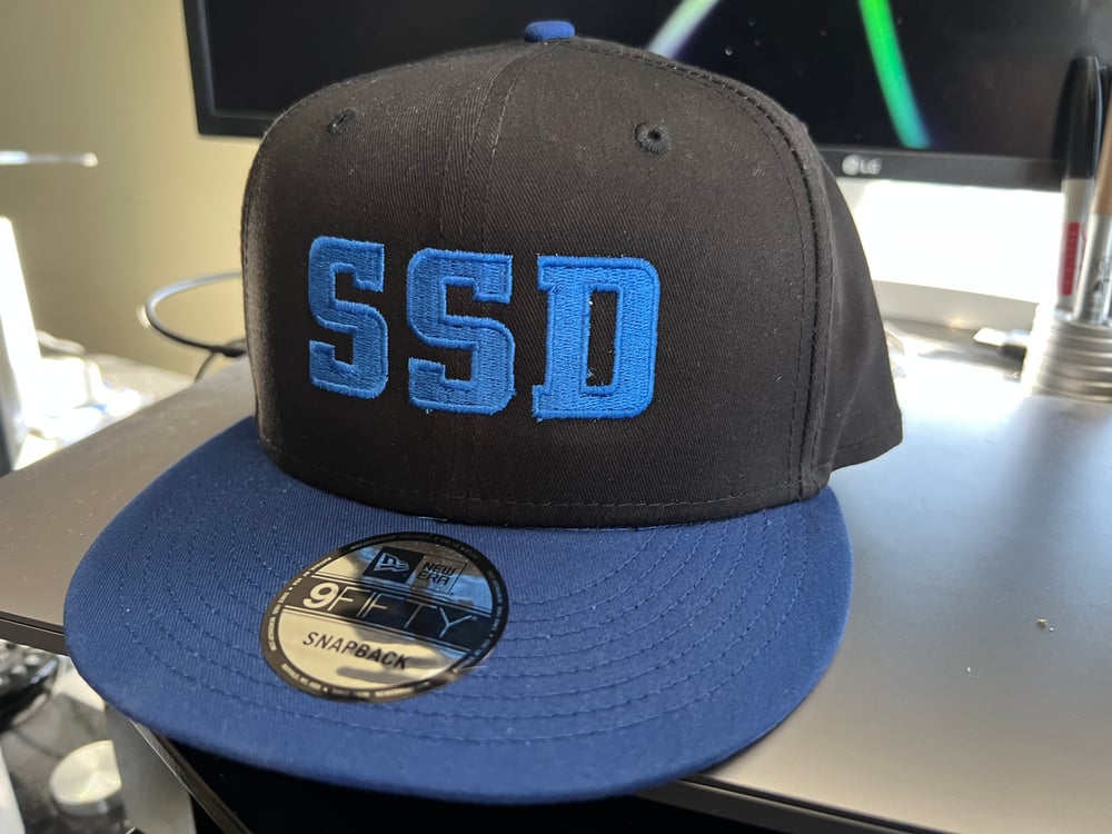 New Era SnapBack Hat With solid Blue SSD Logo