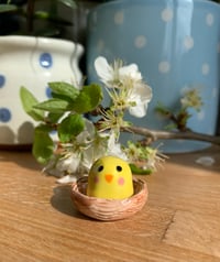 Image 2 of Ceramic Pink Cheek Chick in a basket