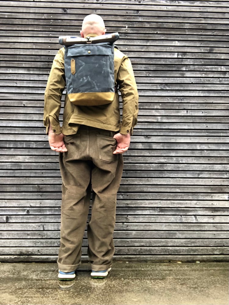Image of Backpack made with recycled base and roll to close top