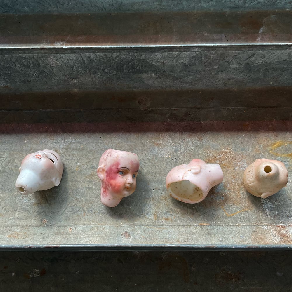 Image of Four Tiny Doll Heads