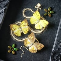 Image 2 of Viper skeleton and yellow butterflies