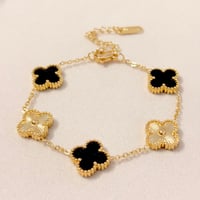 Image 1 of Gold & Black Clover Bracelet