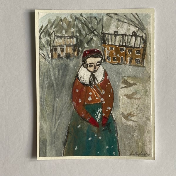 Image of Woman with feather in a winter landscape 