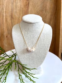 Floating puka necklace