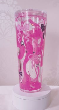 Hot pink lava drip glitter bows & bats snowglobe 24 oz acrylic tumbler. 