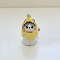 Image 1 of White and gray banana kitty ceramic figurine