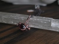 Image 3 of Mink vertebra with garnet 