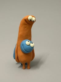 Image 3 of A blue thing peeking out of a brown thing 2