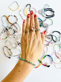 Image 2 of FUCK TRUMP MORSE CODE IN DAISIES BRACELET TEAL