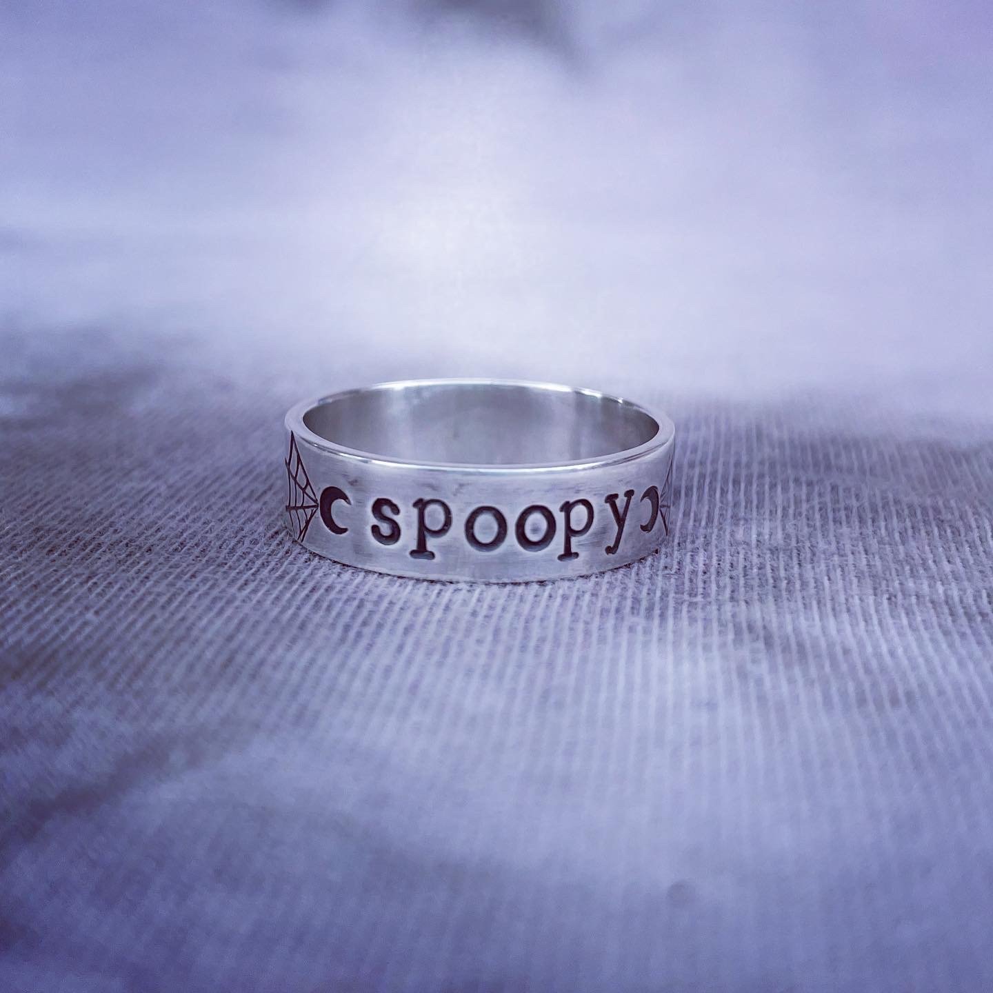 Image of Spooky silver ring with moon and spider web stamps. Spooky halloween silver 925 ring.