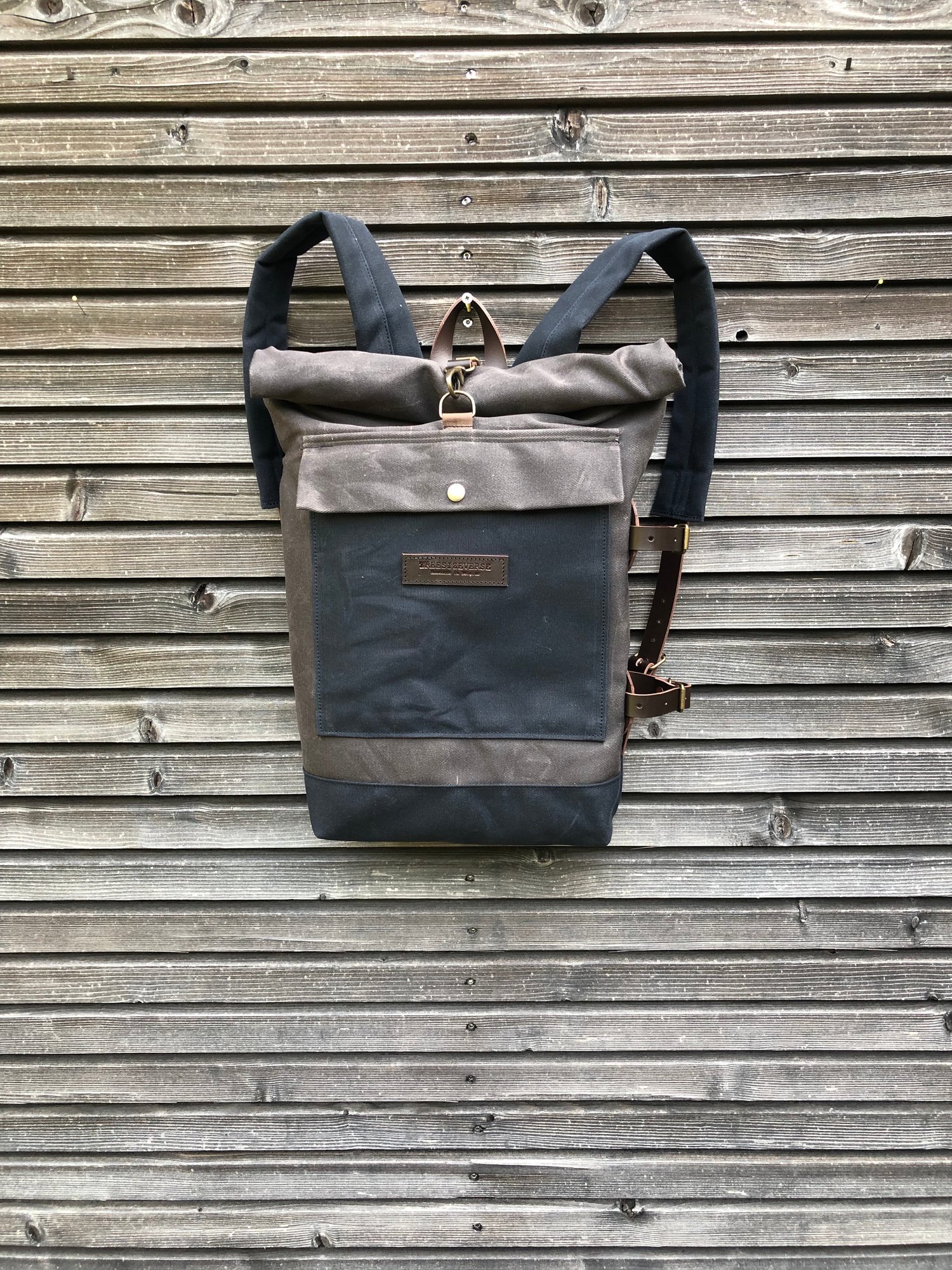 Image of Backpack in waxed canvas with detachable leather side straps and padded shoulder straps