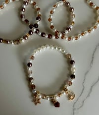 Image 5 of Starlight Shimmer Gold, Champagne, and Cream Tumbler Bracelet Stack