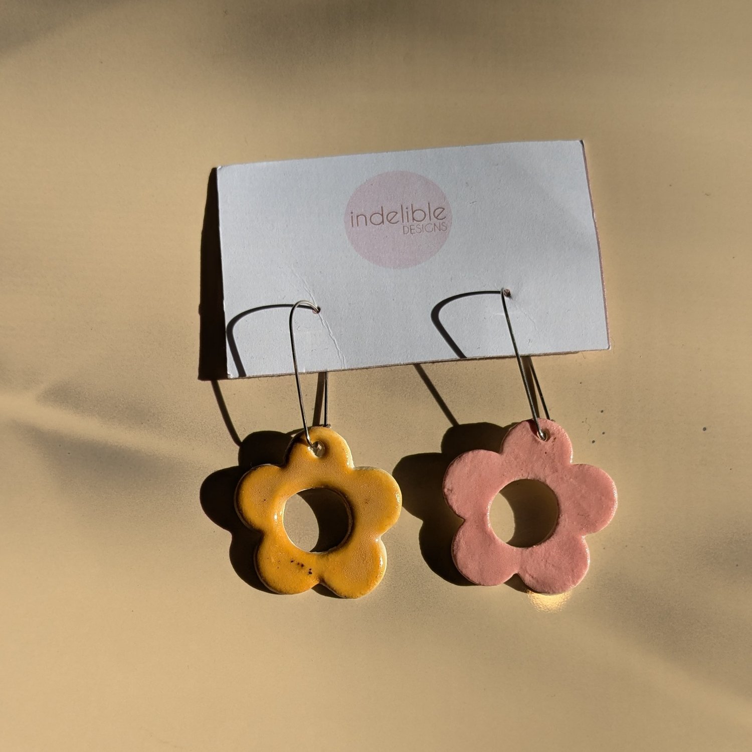 Image of mustard and pink daisy asymmetrical earrings