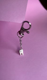 Image 4 of micro tooth charm