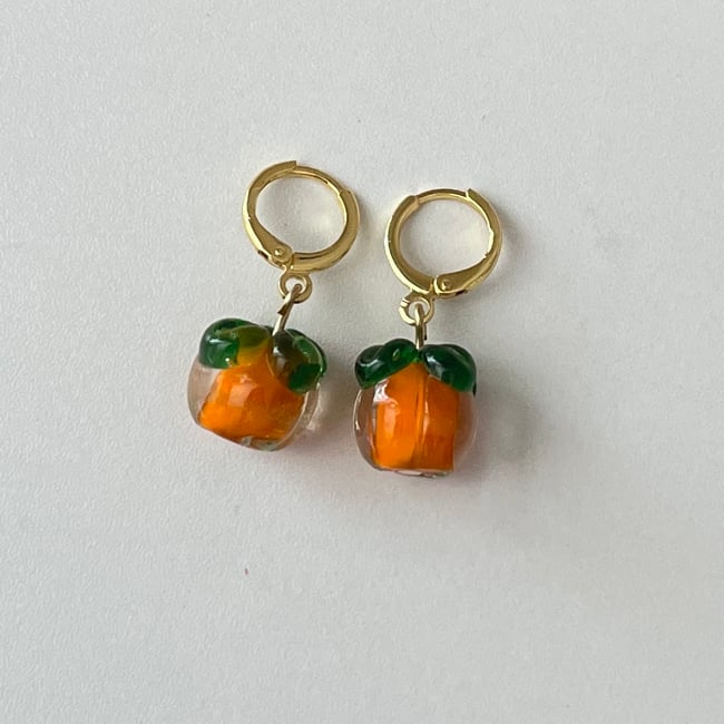 'glass persimmon' huggie hoop earrings