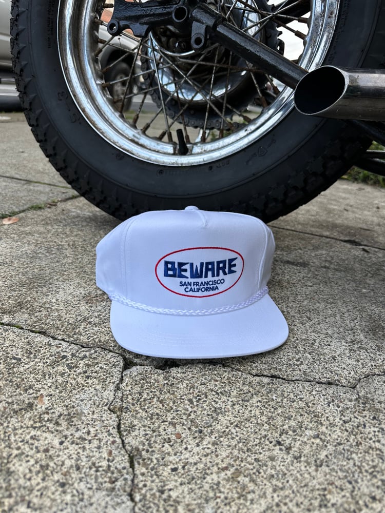 Image of beware old logo hat 