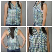 Image of plaid button up/no sleeves