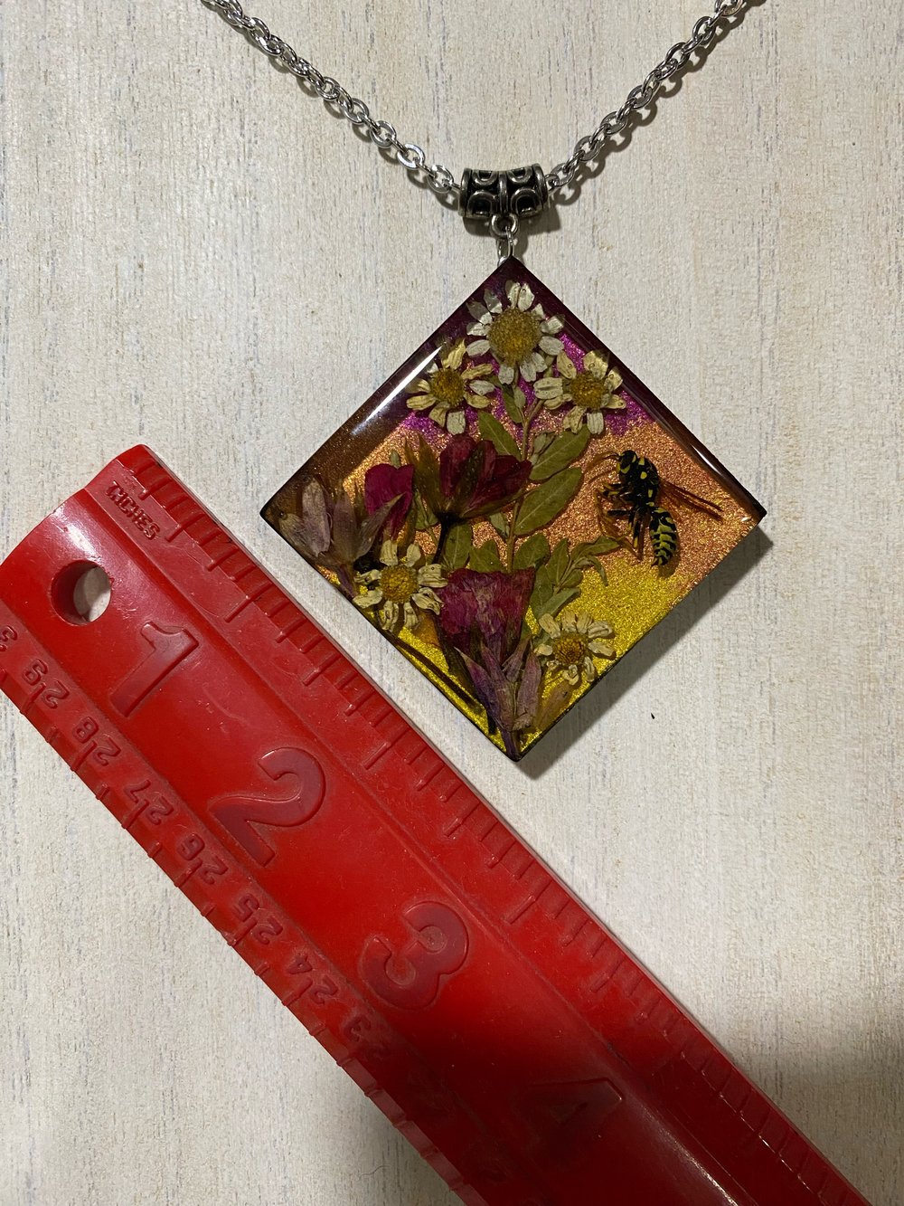 Wasp floral scene pendant 