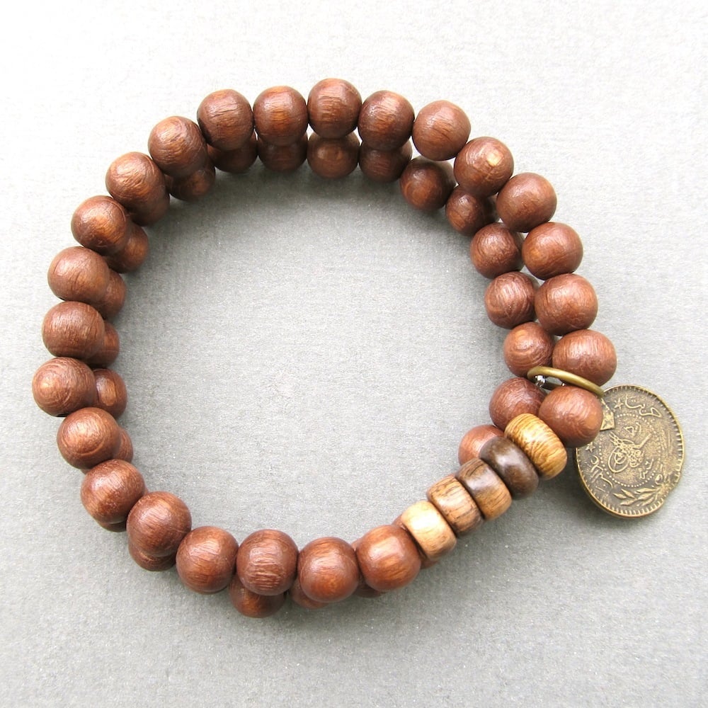Image of Double brown beaded stretch bracelets with coin charm