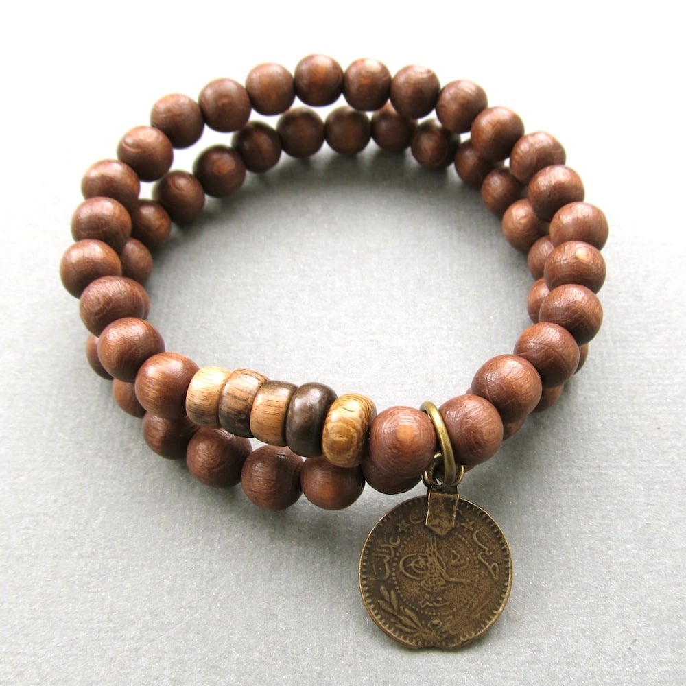 Image of Double brown beaded stretch bracelets with coin charm