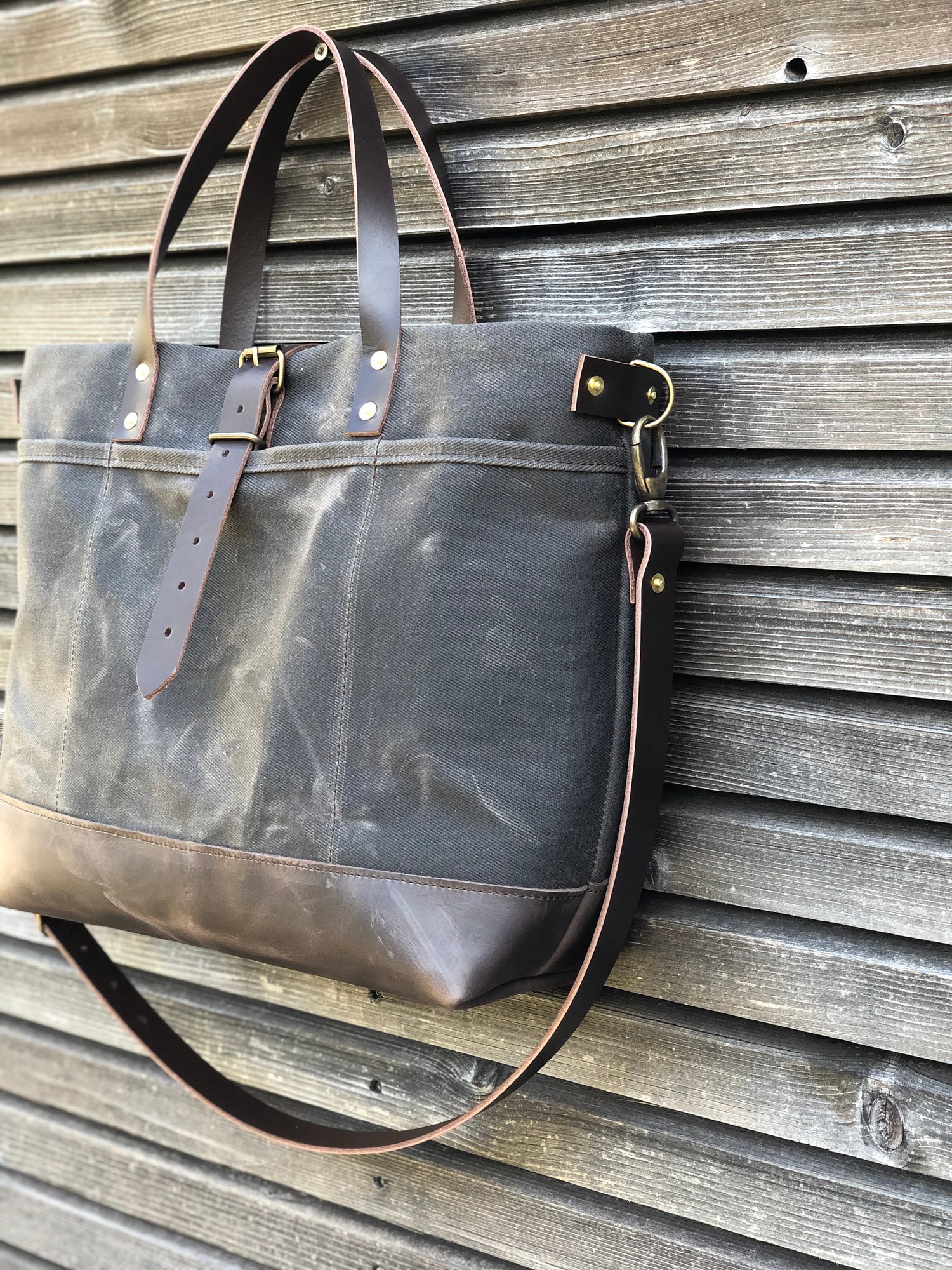 Image of Tote bag in grey brown waxed canvas with leather bottom and cross body strap