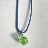 Image 4 of Swirling green planet