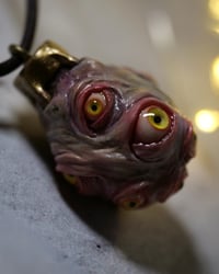 Image 6 of Egg of the King pendant, leather cord, brass hardware, all seeing glowing eyes