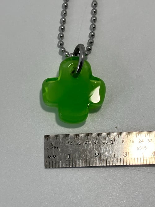Image of green over green plus 