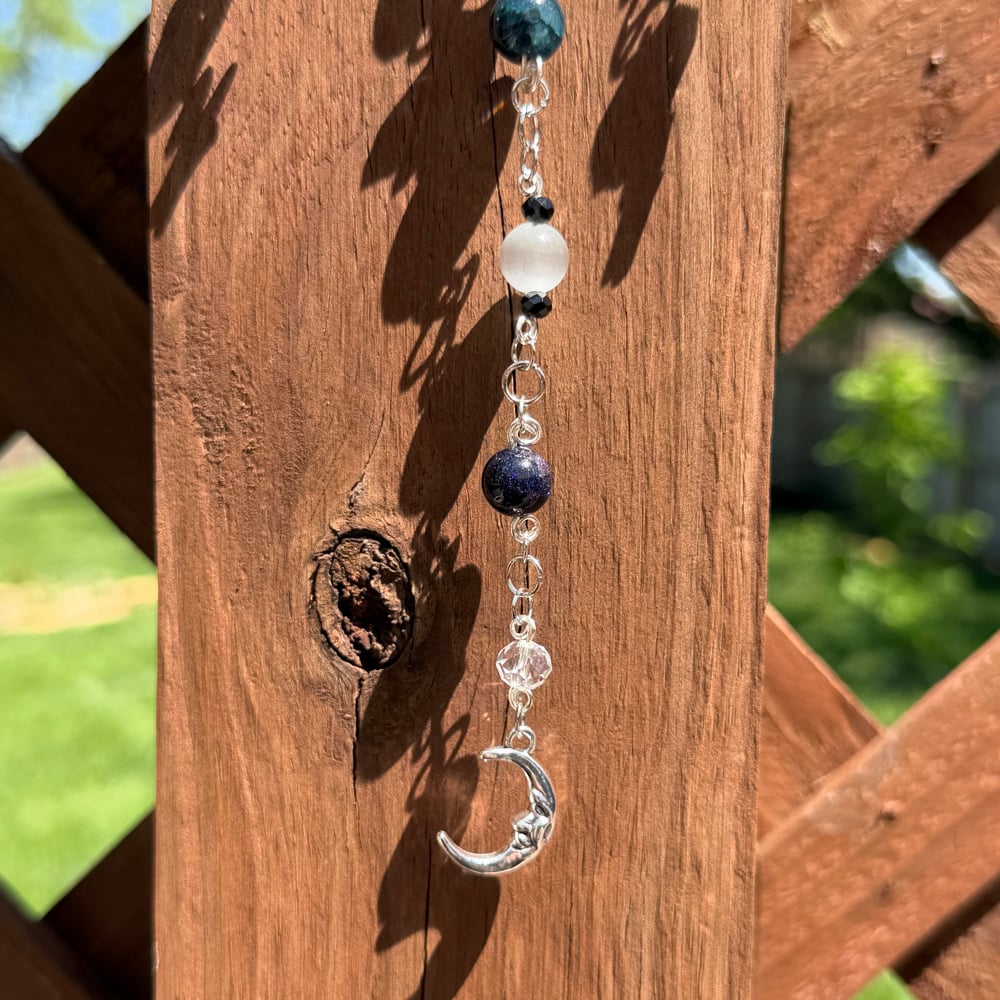 Image of face in the moon sun catcher 