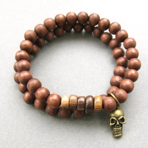 Image of Double brown beaded stretch bracelets with skull charm