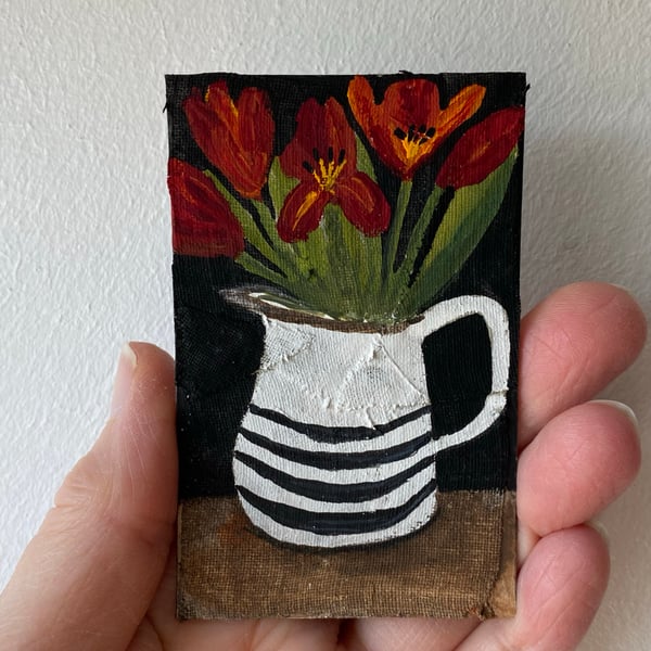 Image of crimson tulips in a striped jug - tiny painting 