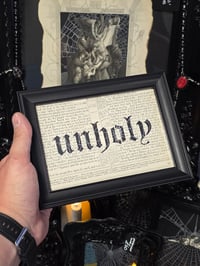 Image 1 of "UNHOLY" 1800's bible page with preserved spider web