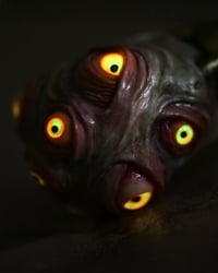 Image 12 of Egg of the King pendant, leather cord, brass hardware, all seeing glowing eyes