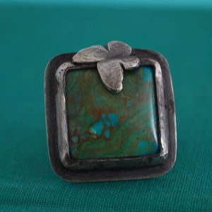 Image of Turquoise Ring adorned with butterfly in Sterling Silver