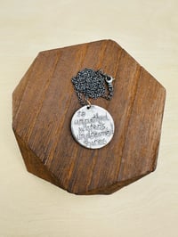 Image 11 of sapphire pendant with hand engraved Shakespeare quote