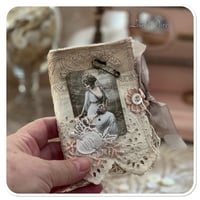 Image 9 of vintage snippet book with a window