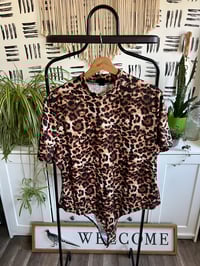 Image 1 of NWT soft light weight leopard bodysuit 