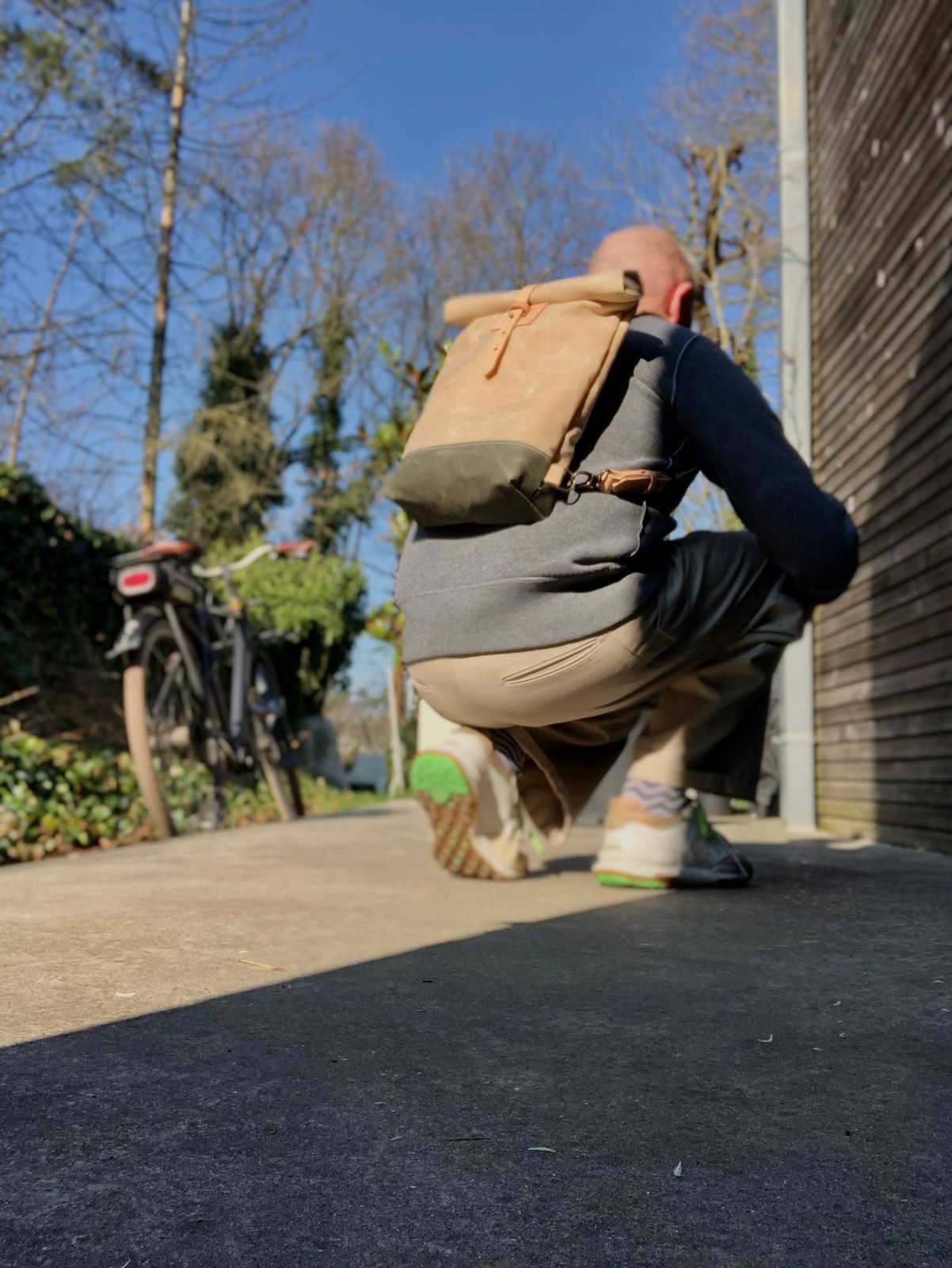 Small waxed canvas backpack in natural with rolled top and leather shoulder straps Treesizeverse