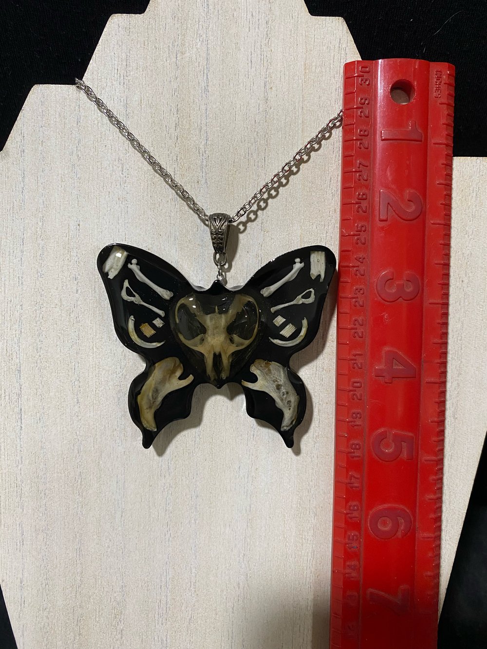 Butterfly skull pendant