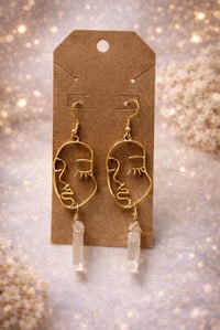 Peaceful face crystal dangles 