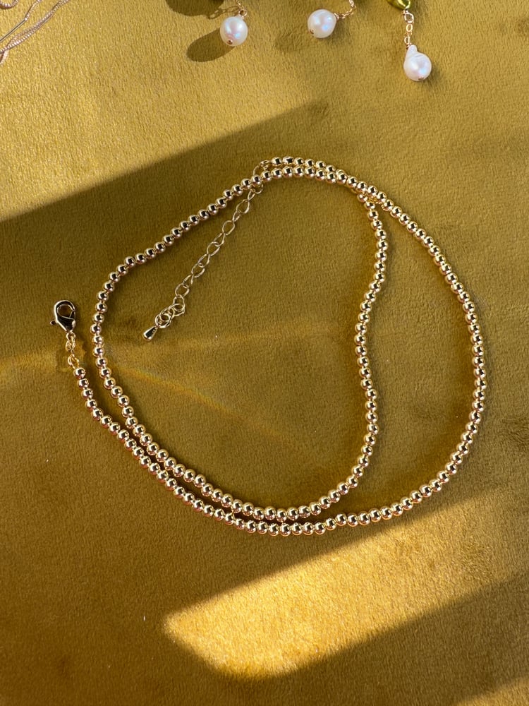 Image of Gold beaded necklace 