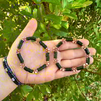 Black Clay Bead Bracelet with Wooden Flower Accents