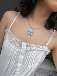 Image 3 of glow ear gumo necklace