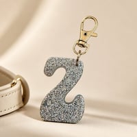 Image 2 of Light Blue Glow Letter Keychain • Personalized Resin Charm