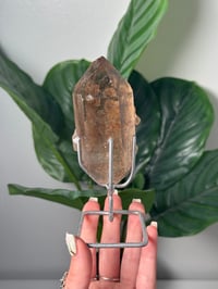 Image 1 of  SMOKEY RUTILE IN QUARTZ CLUSTER ON STAND P