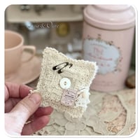Image 4 of A Petite French tin with a needle book and tattered pin cushion
