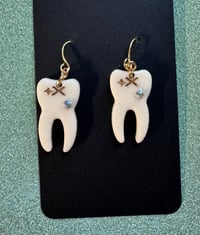 bejeweled tooth dangles