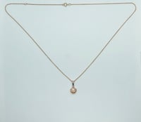 Pearl in seashell 10k necklace